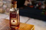 a bottle of four roses bourbon on a table