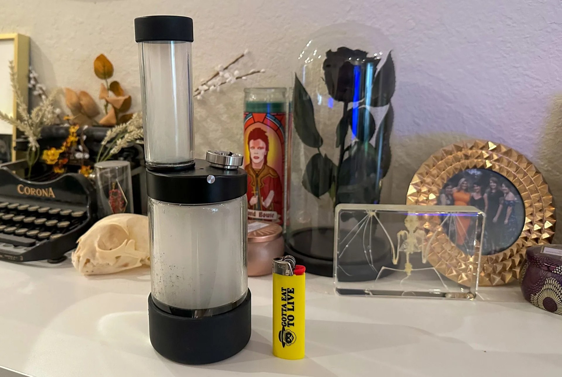 capsule water pipe filled with smoke sitting on a desk