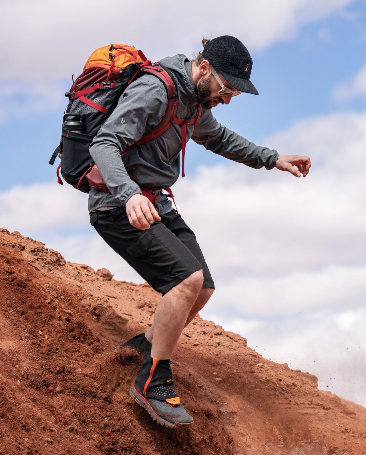man wearing danner x mystery ranch trail 2650 mesh gtx and scree 32 bag