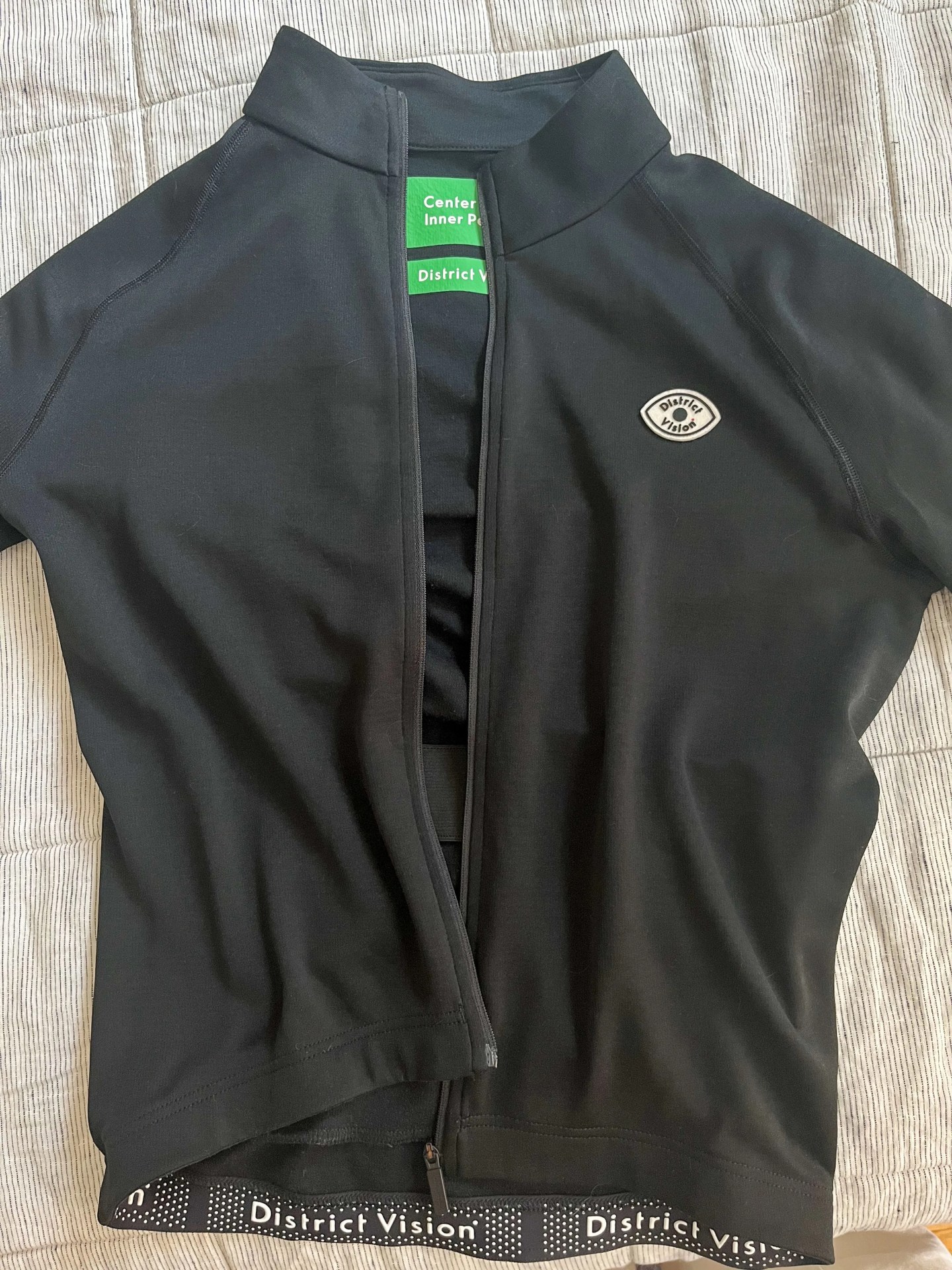 a district vision cycling shirt on a blanket