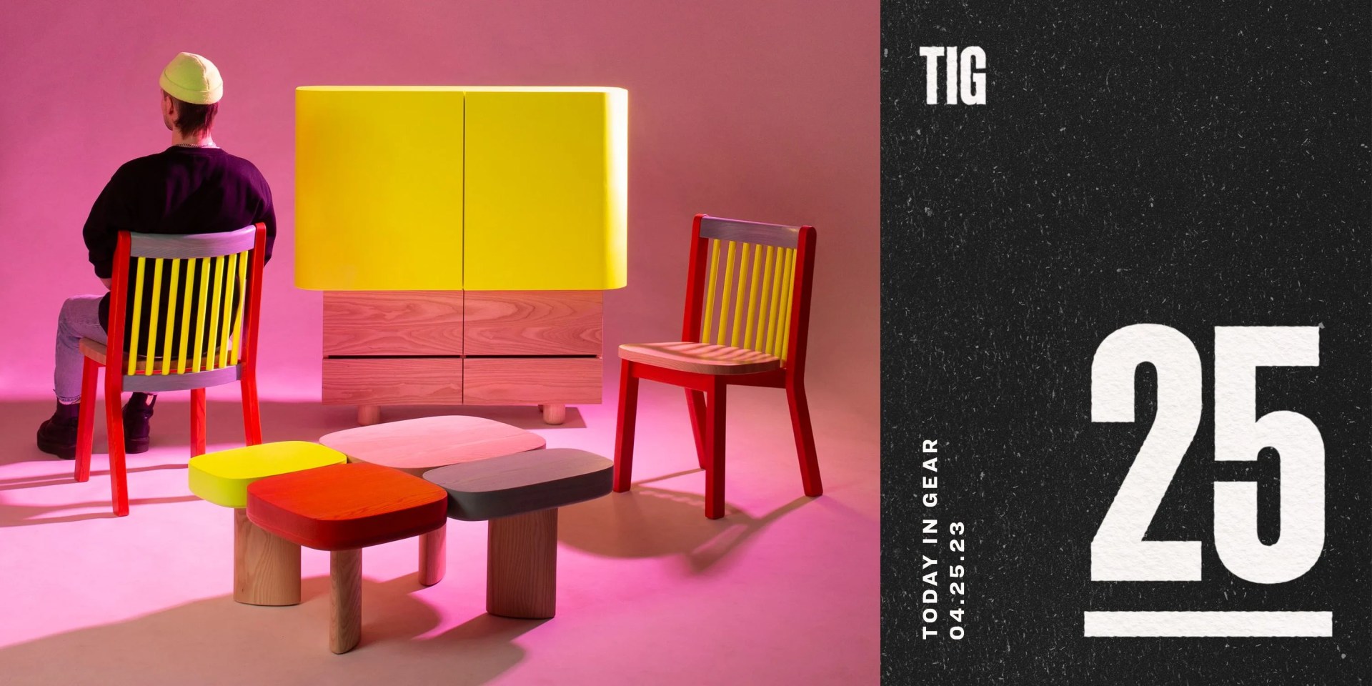 a collection of furniture in a pink room with a man sitting in a chair facing away from the camera