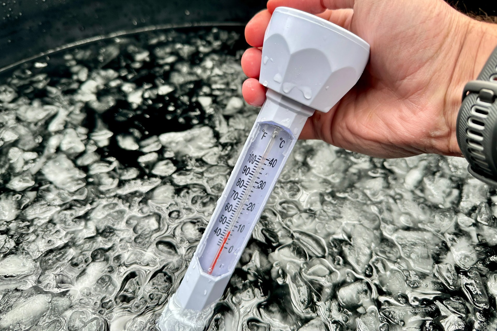 a thermometer in an ice bath
