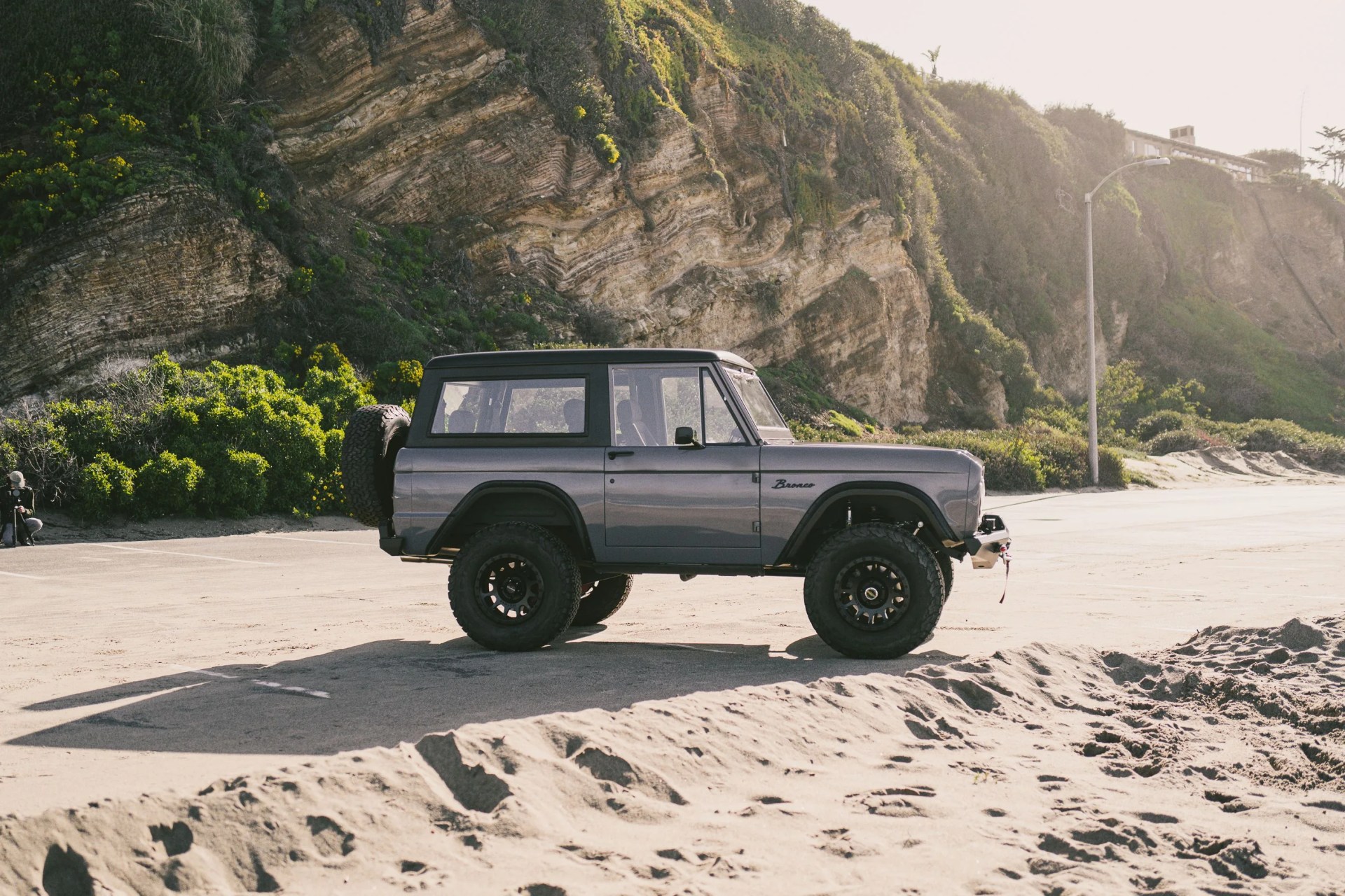 vintage bronco on a california beach