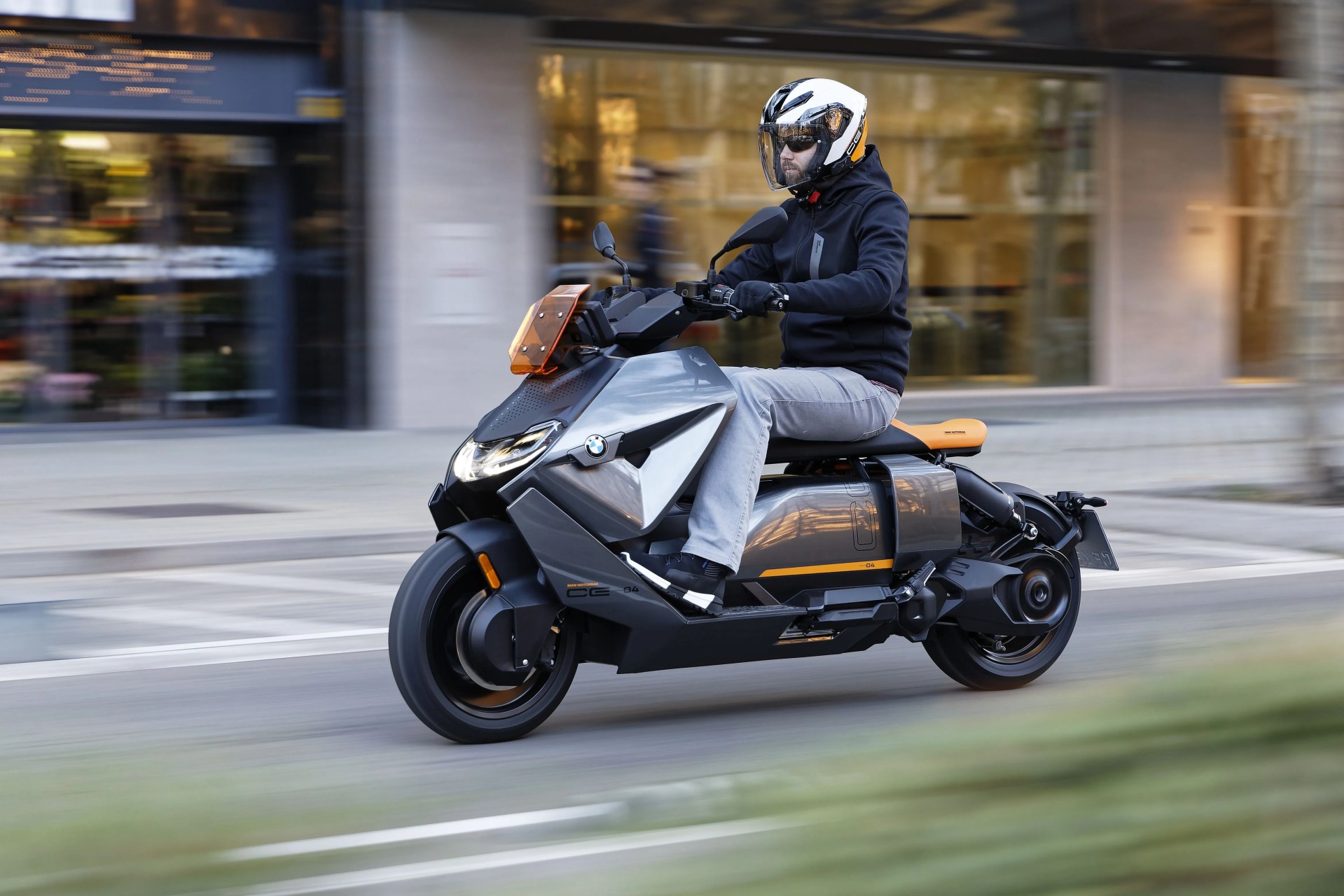 bmw ce 04 electric scooter riding through city streets