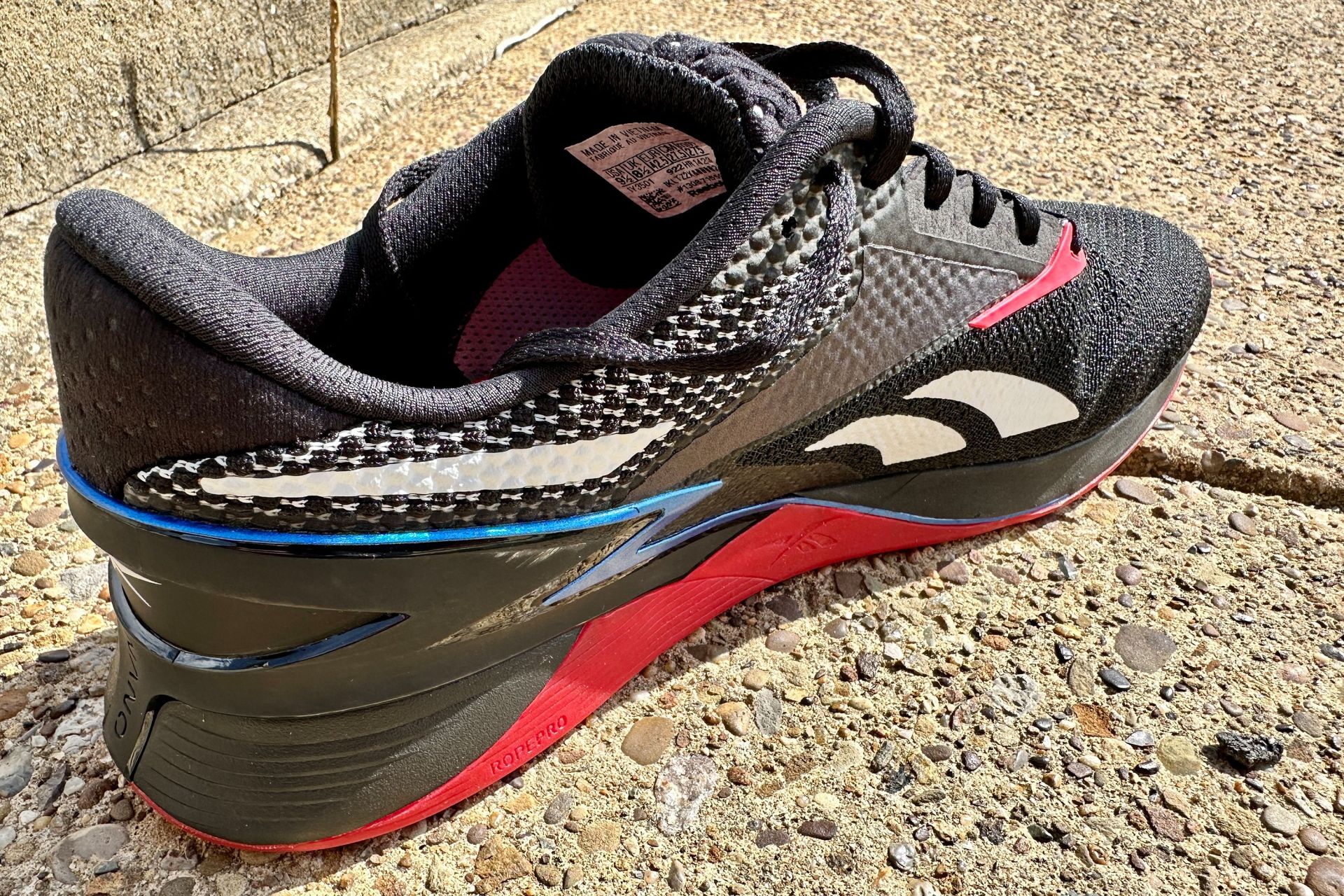 inside midsole of a reebok shoe on a sidewalk