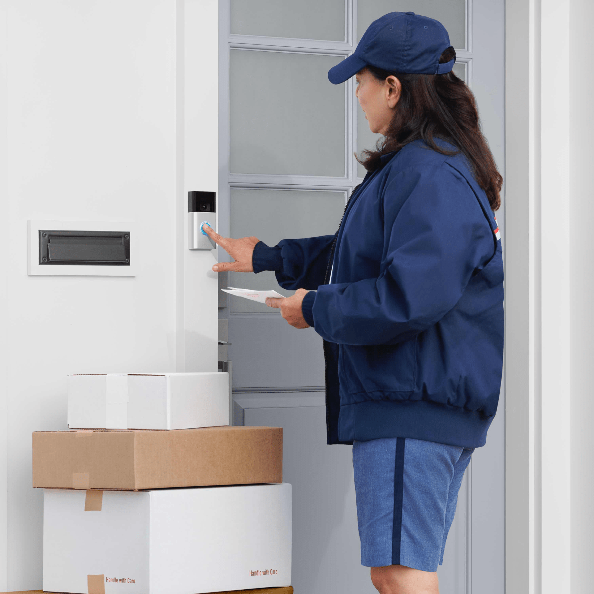 usps worker with packages ringing ring video doorbell