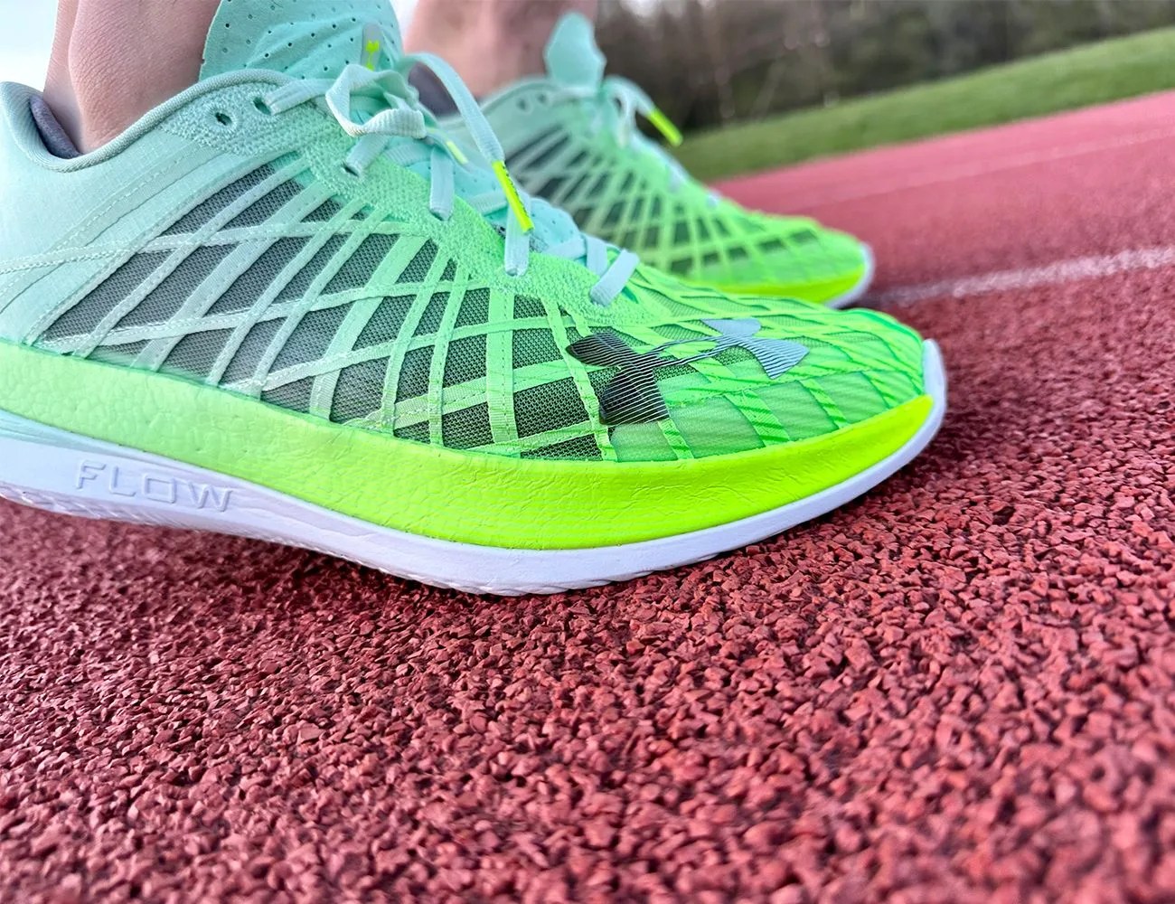 close up of a pair of running shoes on a track