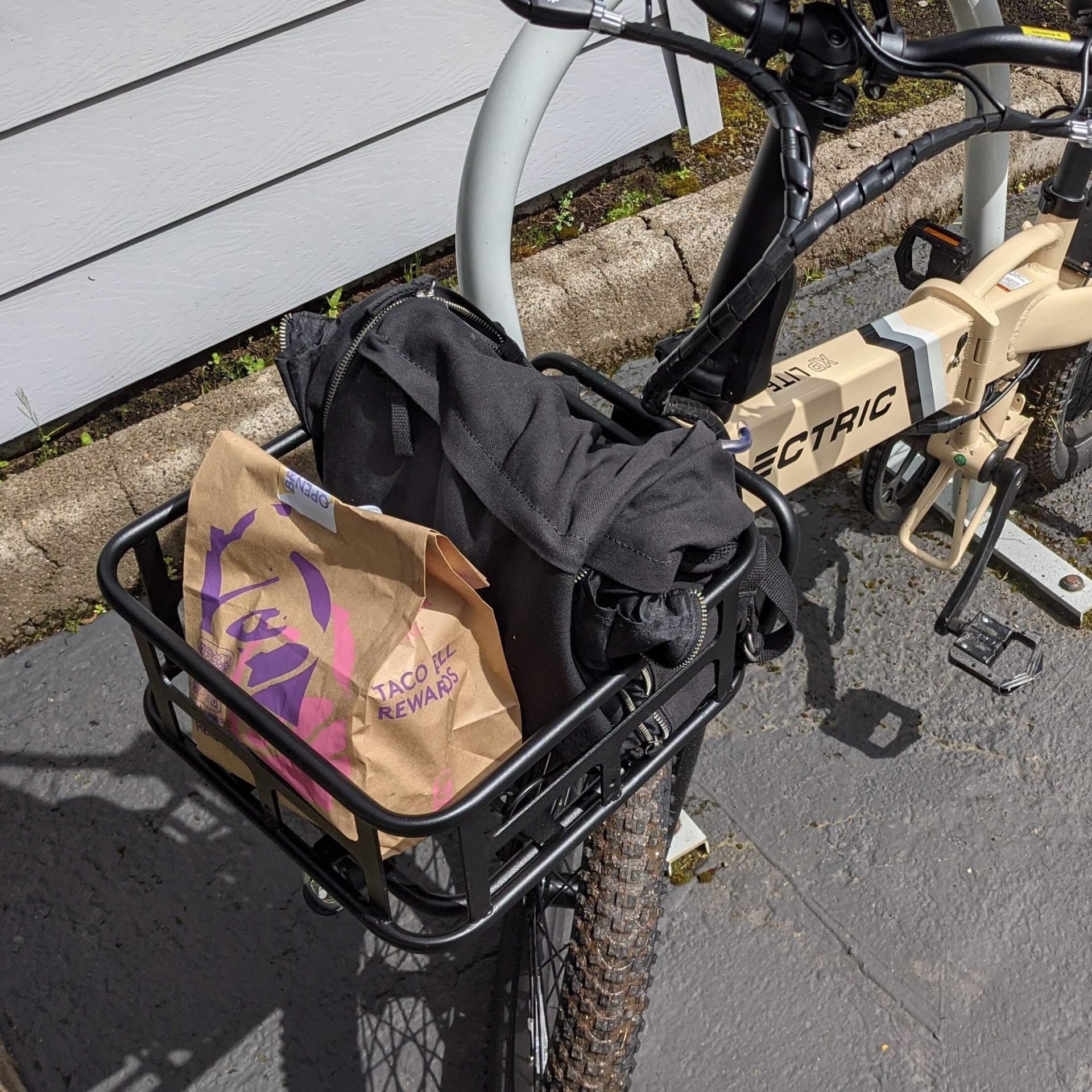 the front rack of the xp lite opens up storage for a backpack and fast food
