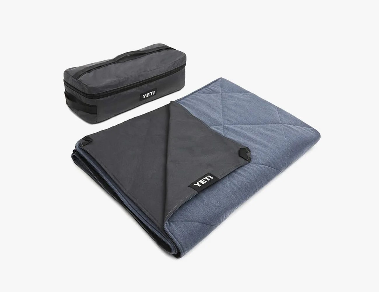 a folded gray technical blanket