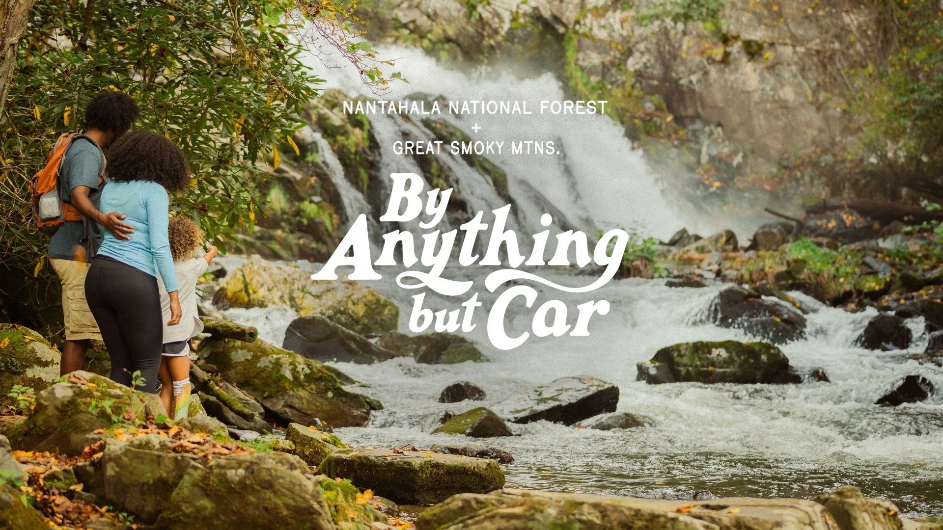 By Anything But Car Nantahala National Mountains + Great Smokey Forest family looking at a small waterfall