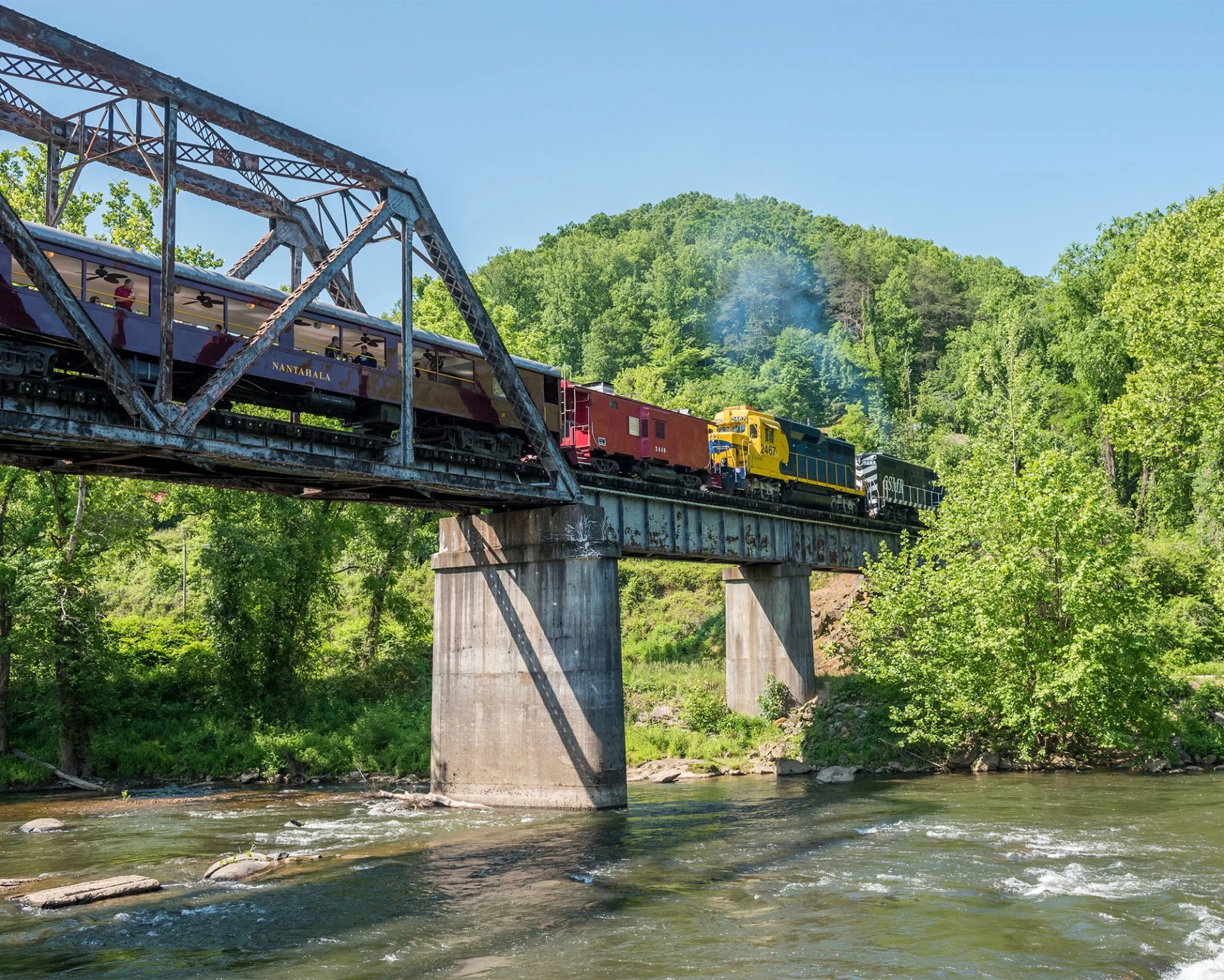 a train crossing a railroad bridge