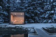 a couple relaxing in an outdoor sauna in the winter