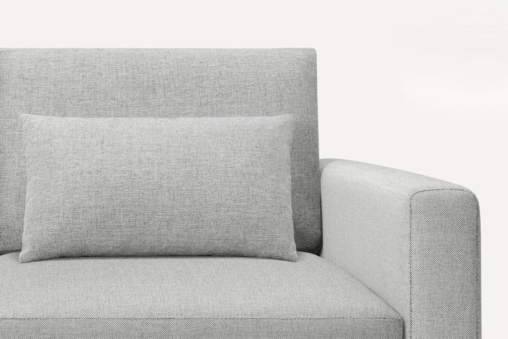 close up of the cushion and arm rest on a burrow nomad couch