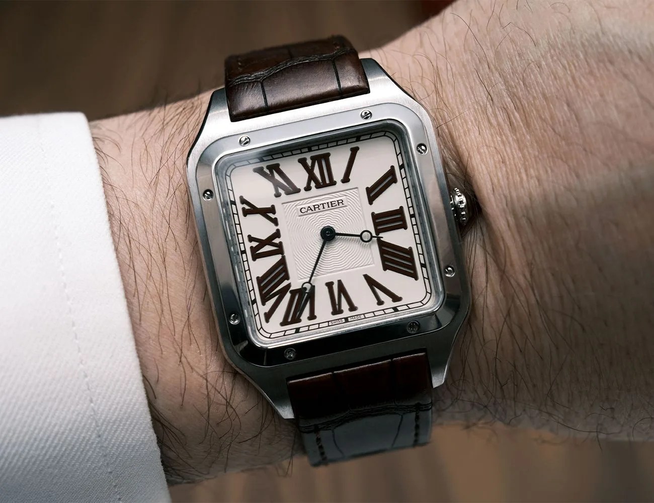 cartier watch on a mans wrist