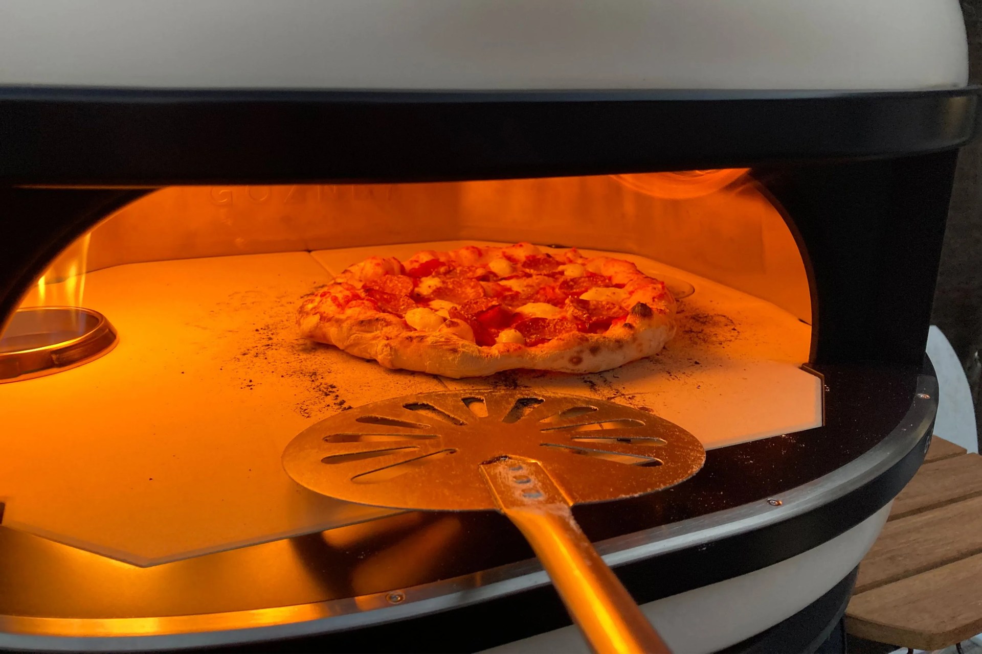 pizza cooking in a gozney dome pizza oven