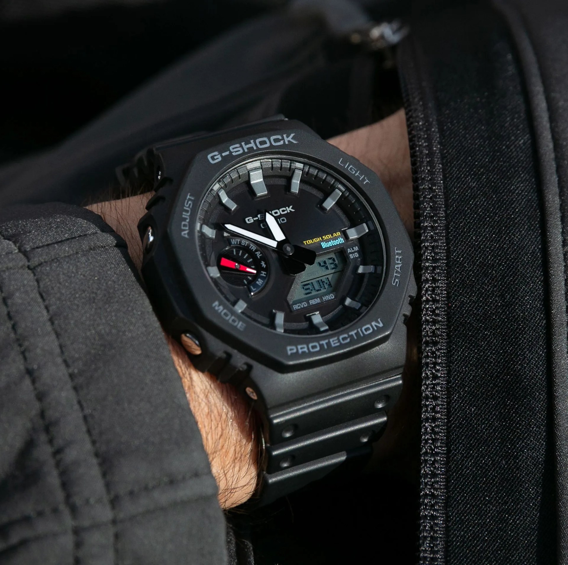 a man wearing a g shock watch