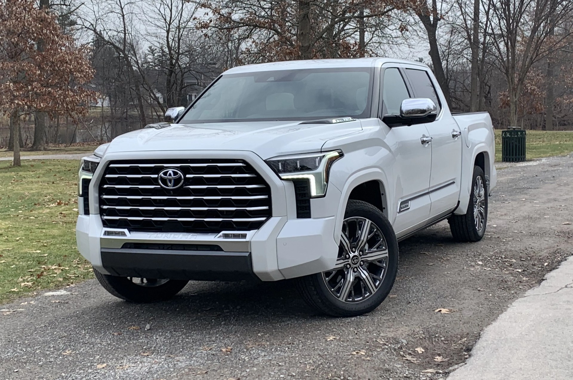 toyota tundra parked in front of a park during winter