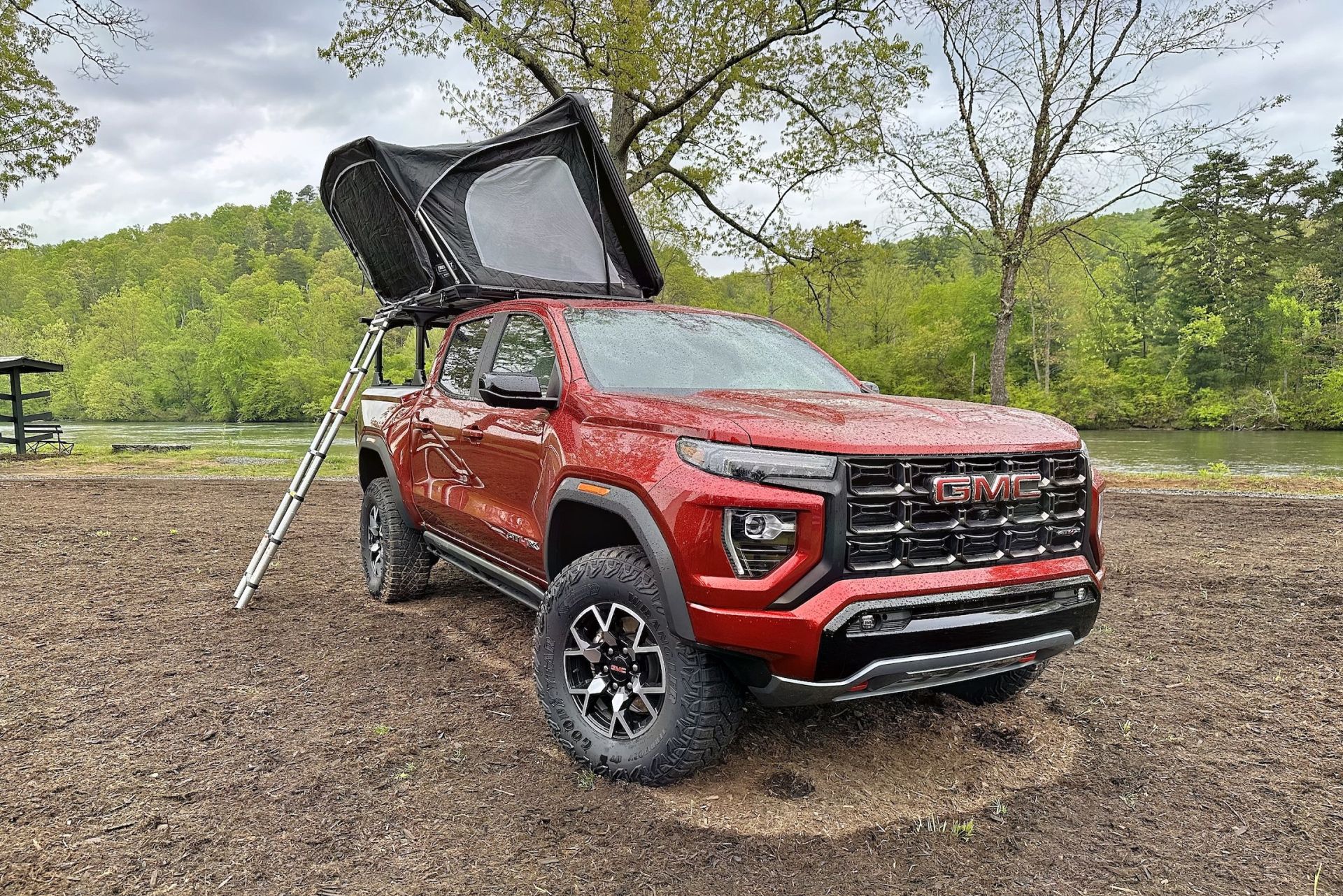 gmc canyon at4x with a rooftop tent on a bed rack