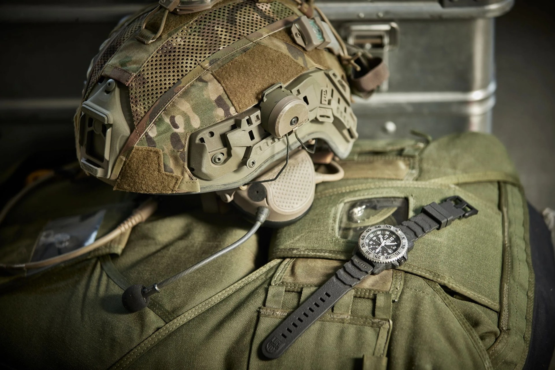 luminox watch resting next to army gear