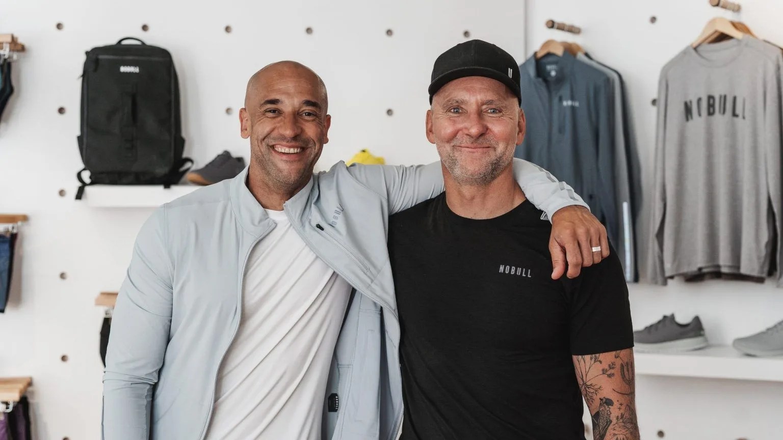 two men standing in a store