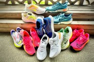 8 pairs of nike shoes on wooden stairs
