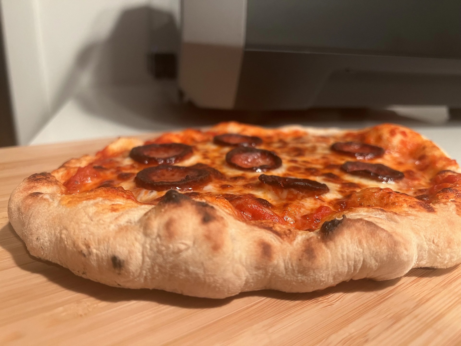 a neapolitan pizza cooked in an ooni volt electric oven