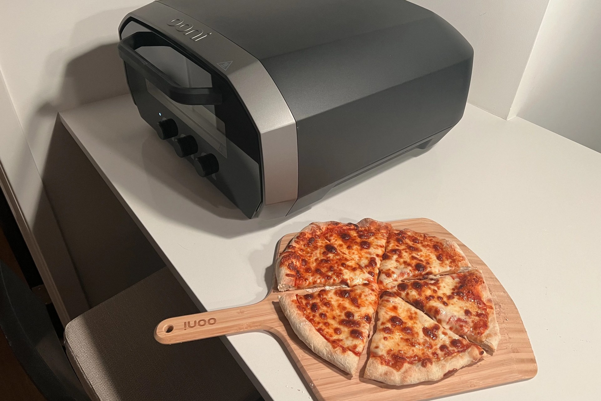cheese pizza cooked in an ooni volt electric pizza oven