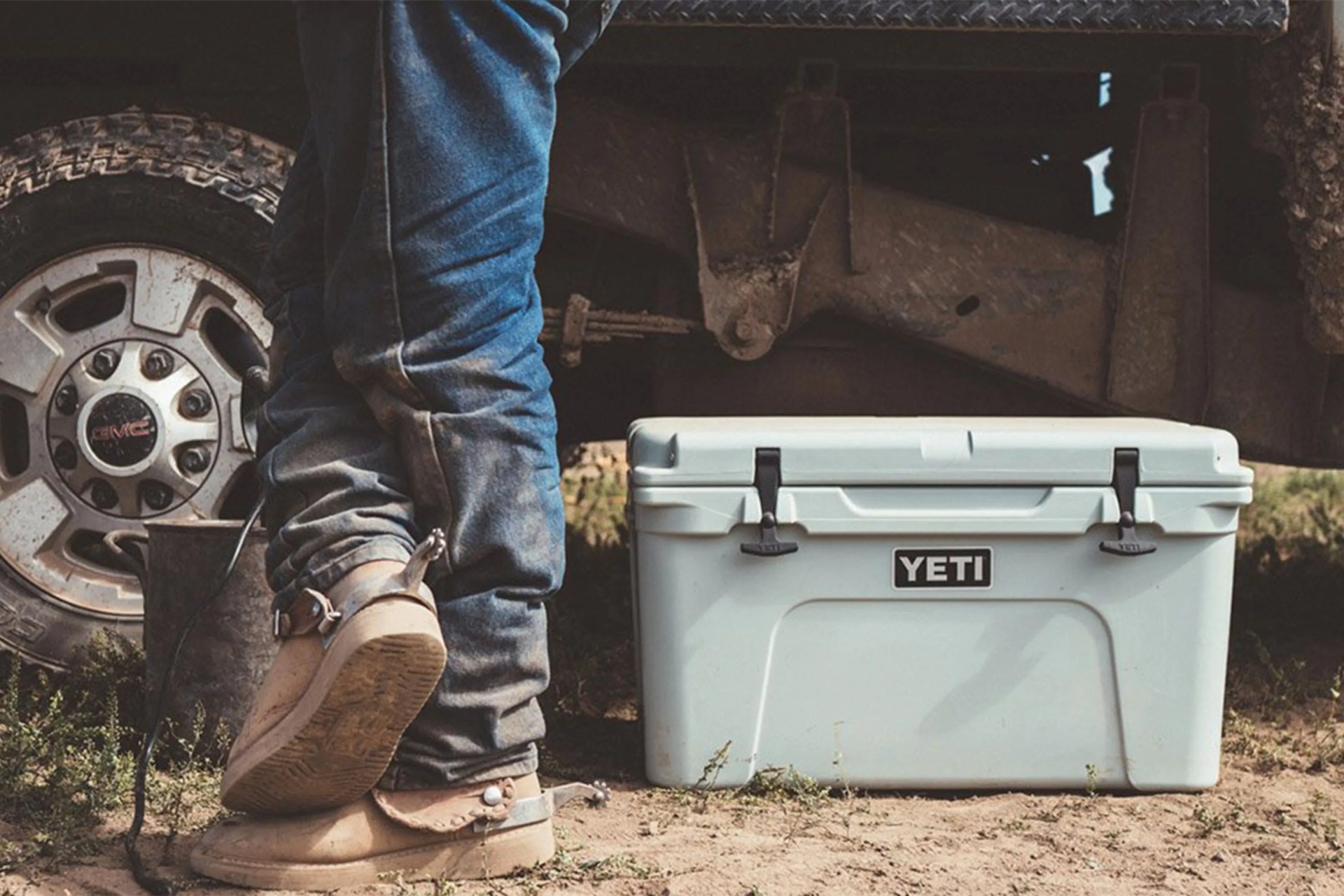 white yeti cooler by car