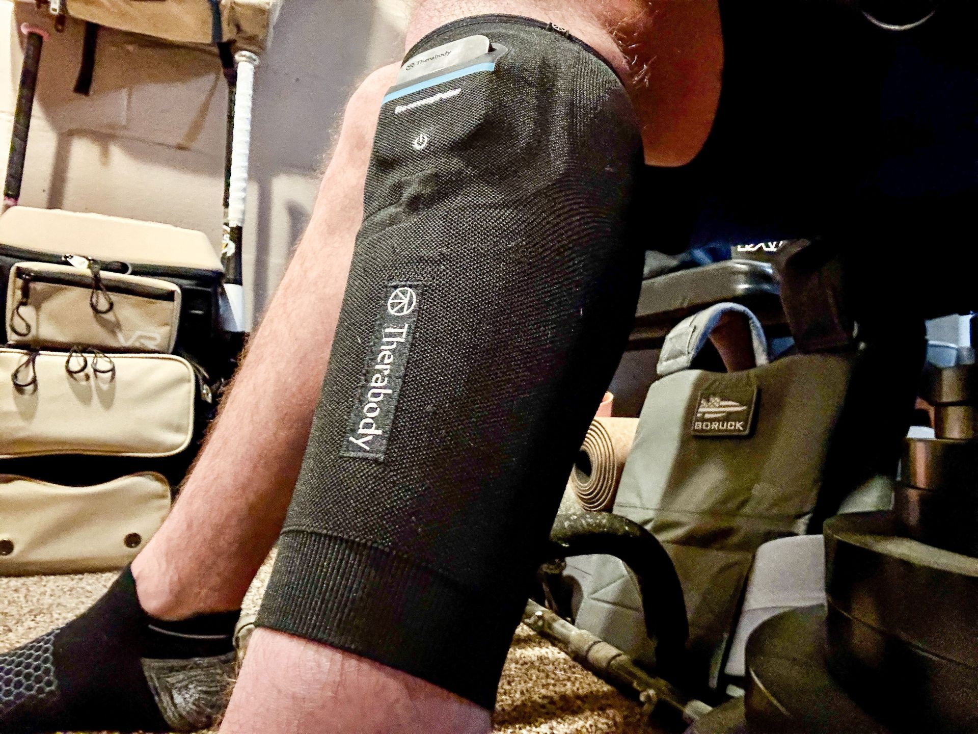 a man wearing the therabody recoverypulse collection
