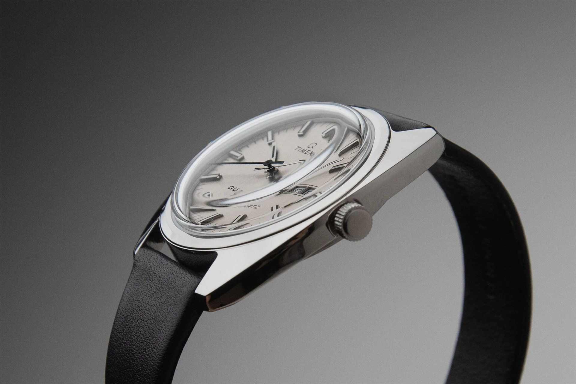 profile of a timex q 1978 reissue day date watch