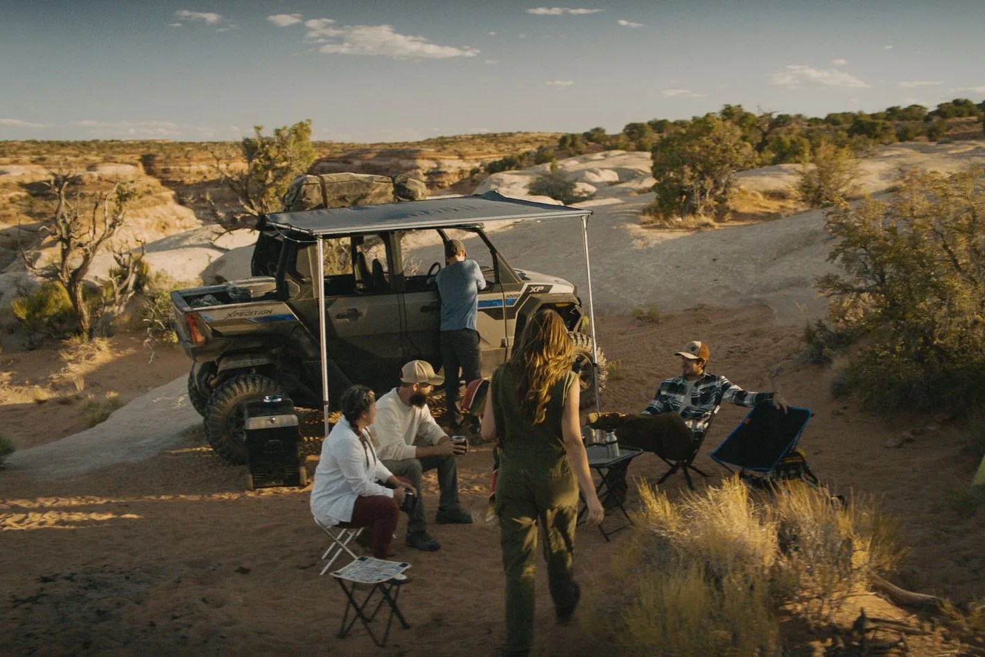 polaris xpedition at campsite with an awning
