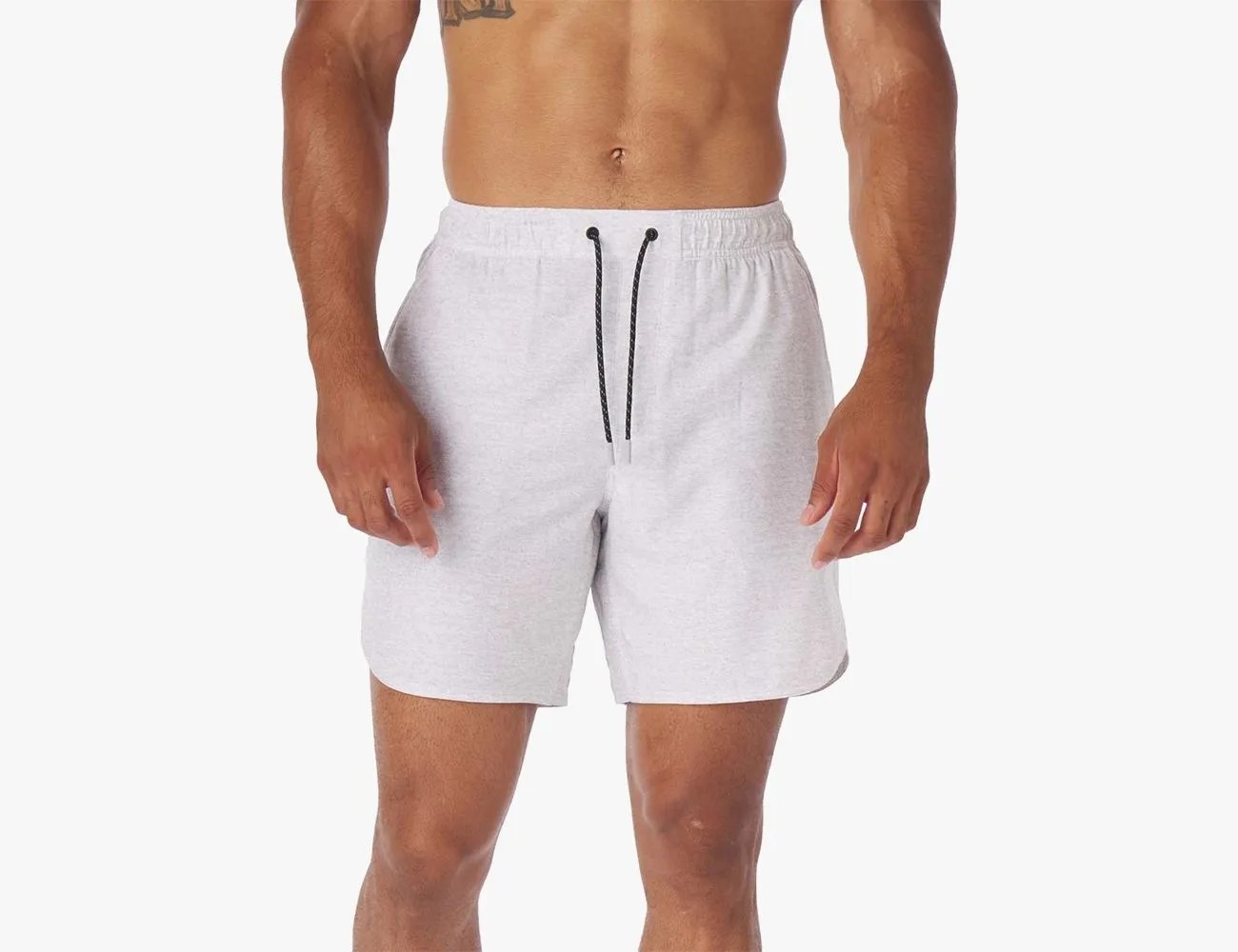 a man wearing white shorts