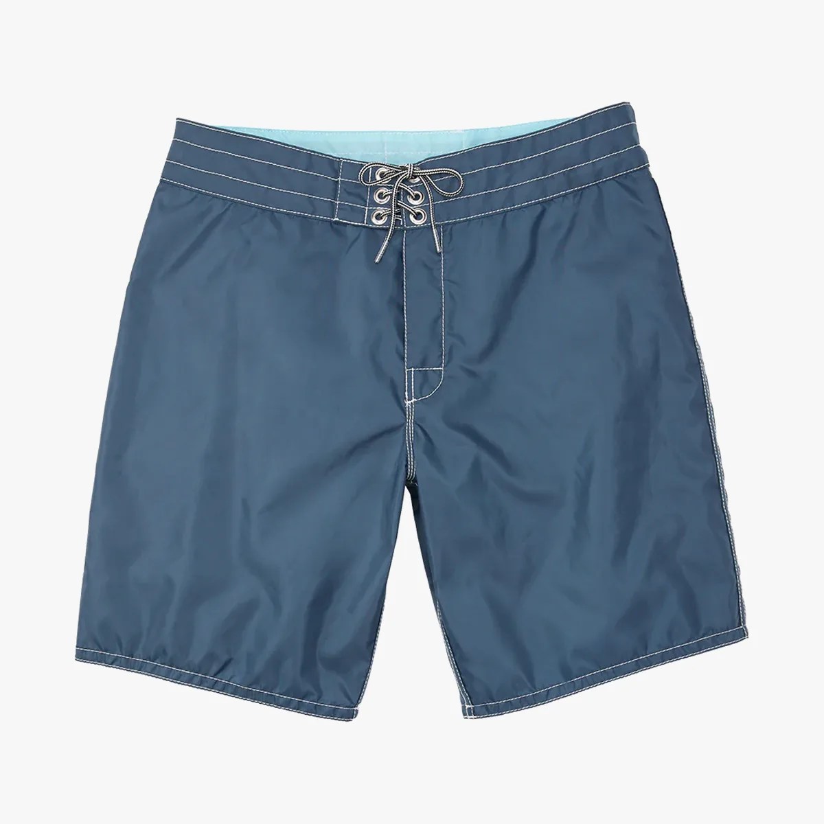 Birdwell 311 Nylon board shorts laying flat in blue on grey background