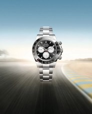 Rolex Daytona Le Mans hovering over blurred racetrack