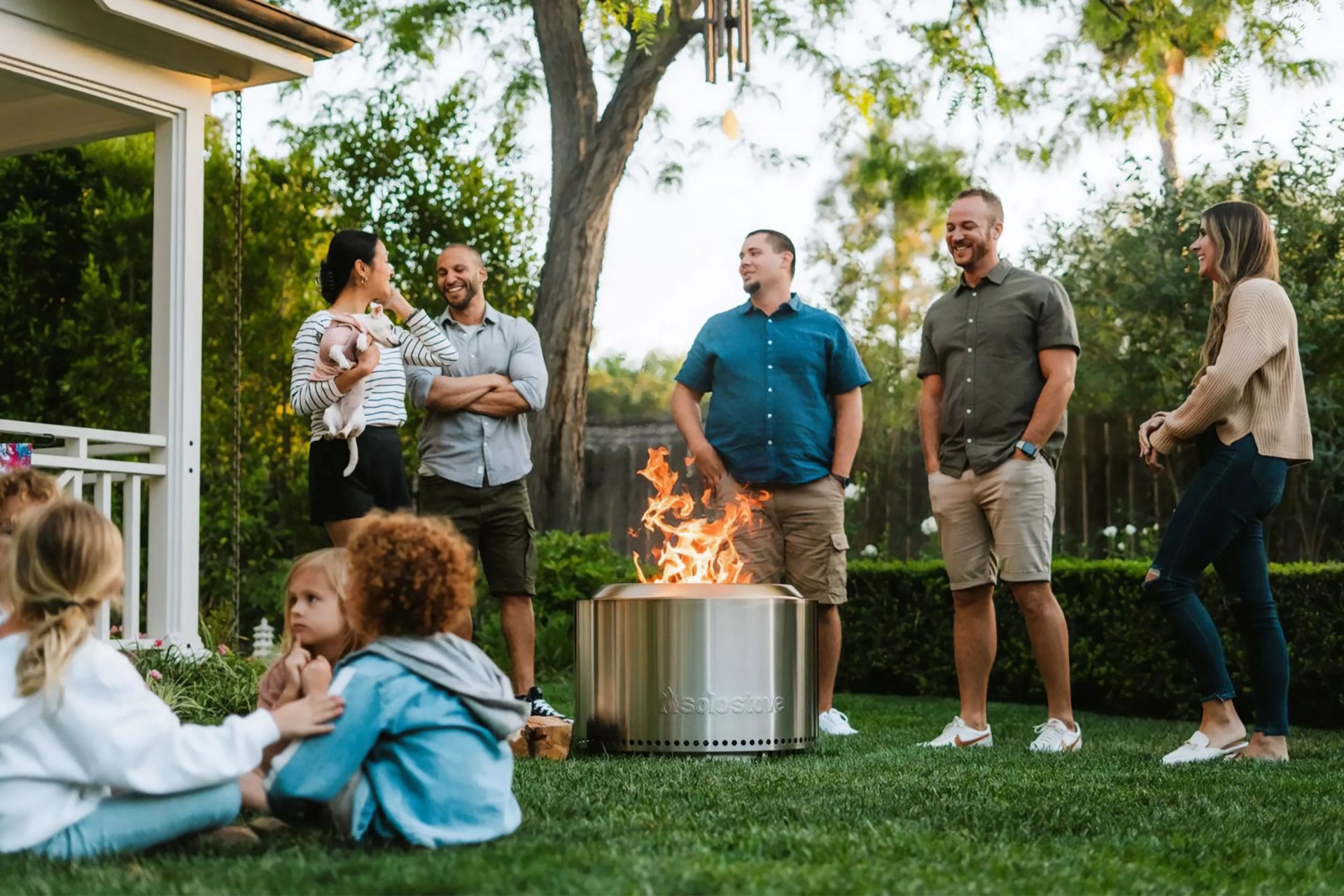 people around a fire pit in a backyard