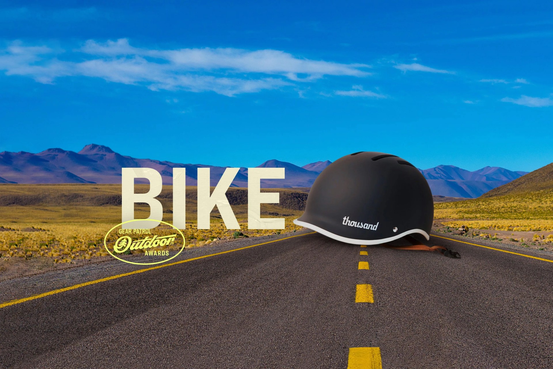 a helmet on a road landscape with a bike headline and outdoor badge icon