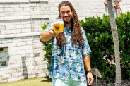 green bench brewing founder holding a glass of beer