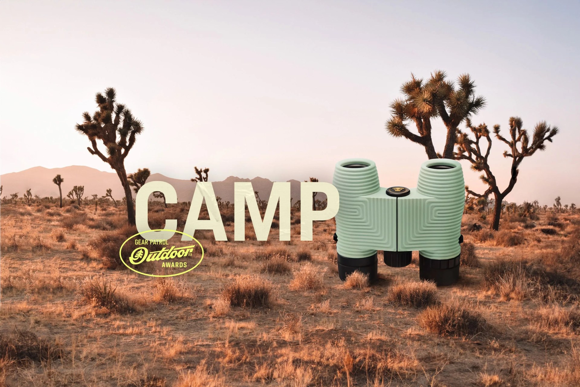 binoculars in a desert landscape with a camp headline and outdoor badge icon
