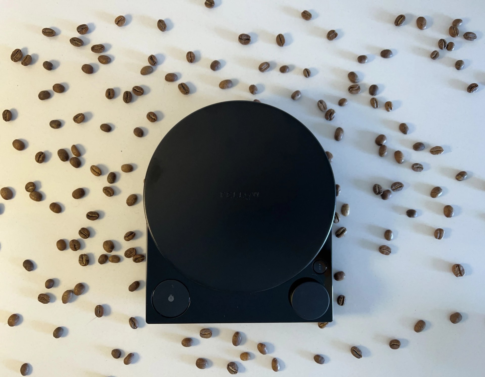 the fellow tally pro coffee scale surrounded by coffee beans
