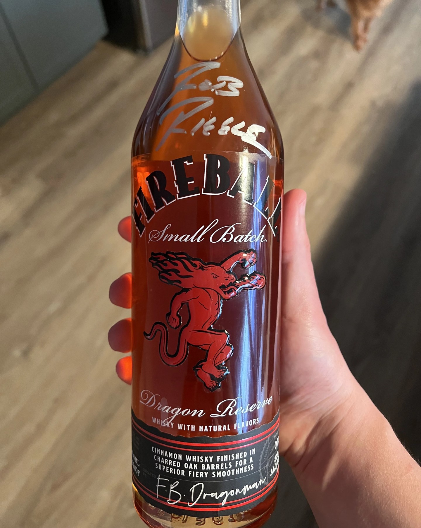 a bottle of fireball dragon reserve signed by rob riggle