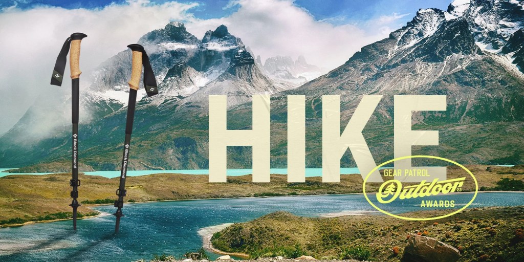 ski poles in a mountain landscape with a hike headline and outdoor badge icon