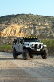 white jeep on a dirt road
