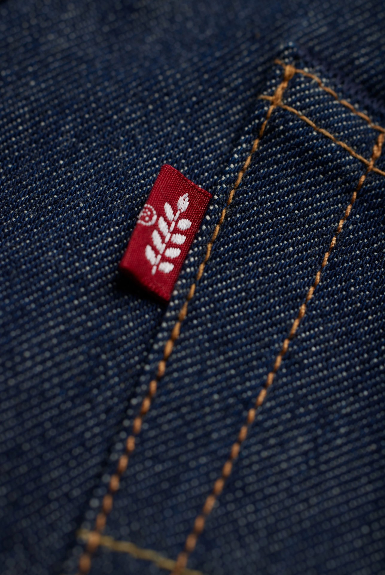close up of the plant based tag on a pair of levis