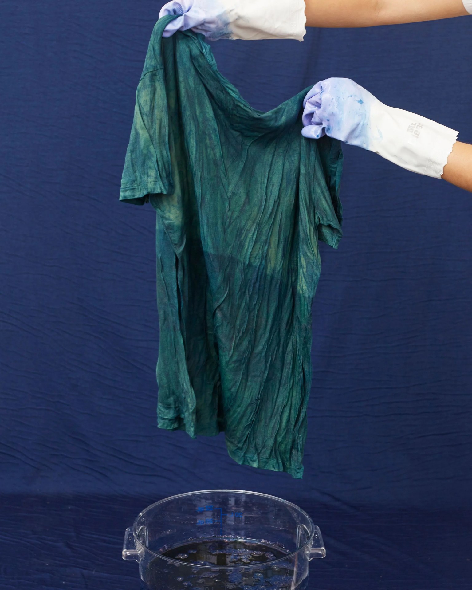 a person dying a tshirt with indigo