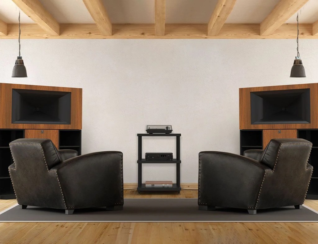 speakers in living room with two chairs