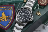 a rolex watch on a rolex box