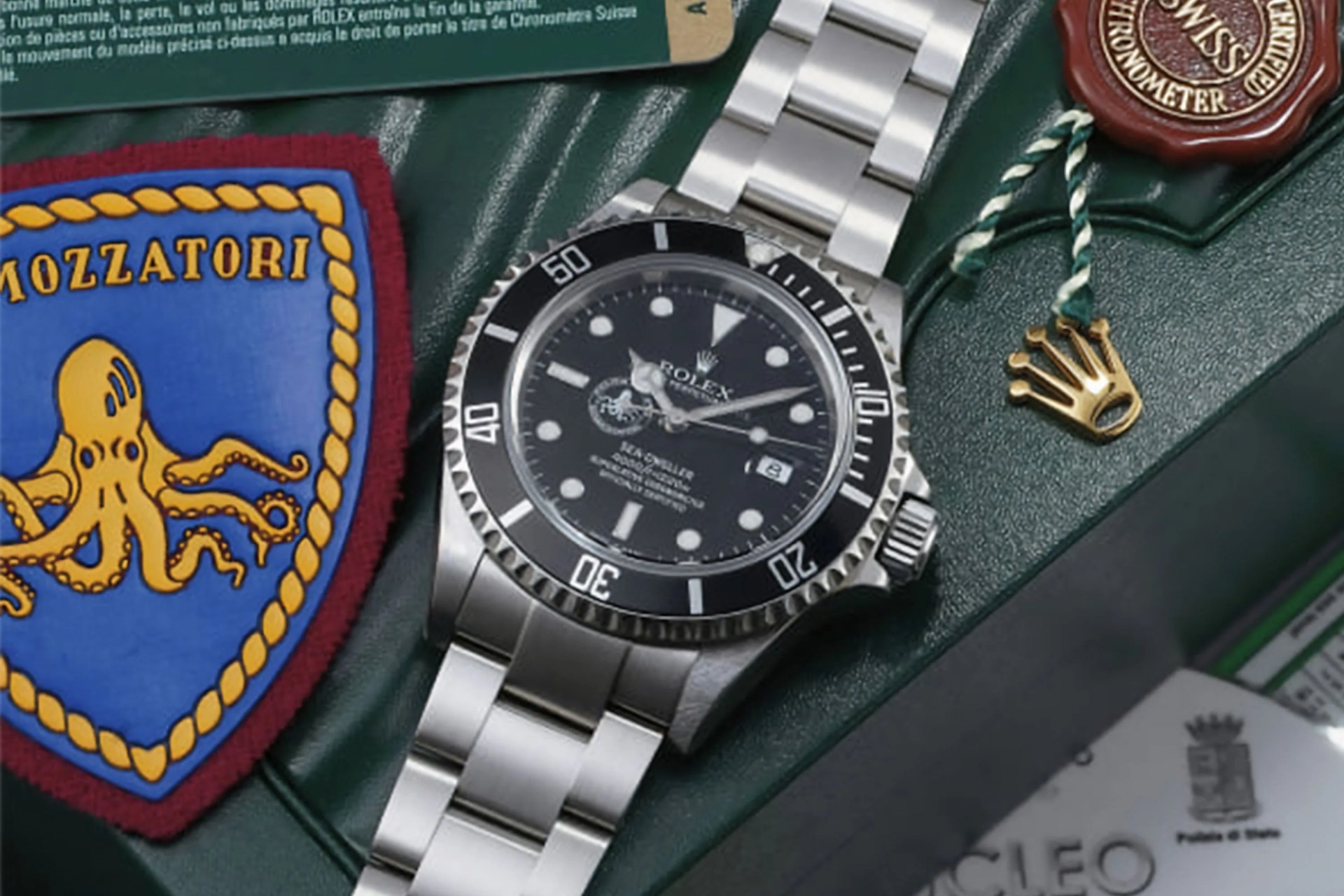 a rolex watch on a rolex box