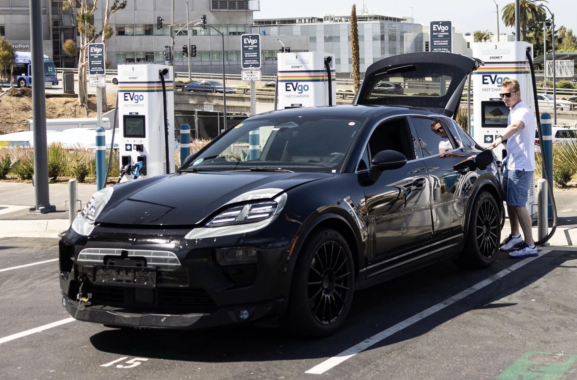 porsche macan ev prototype on a charger testing