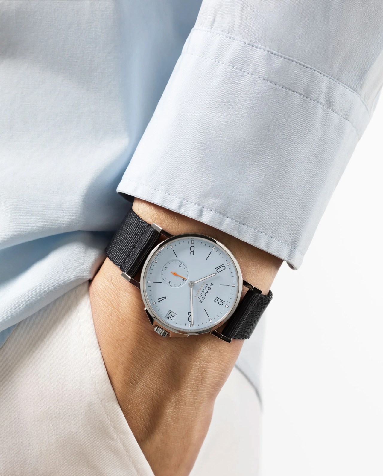 nomos ahoi neomatik 38 watch worn on man's wrist