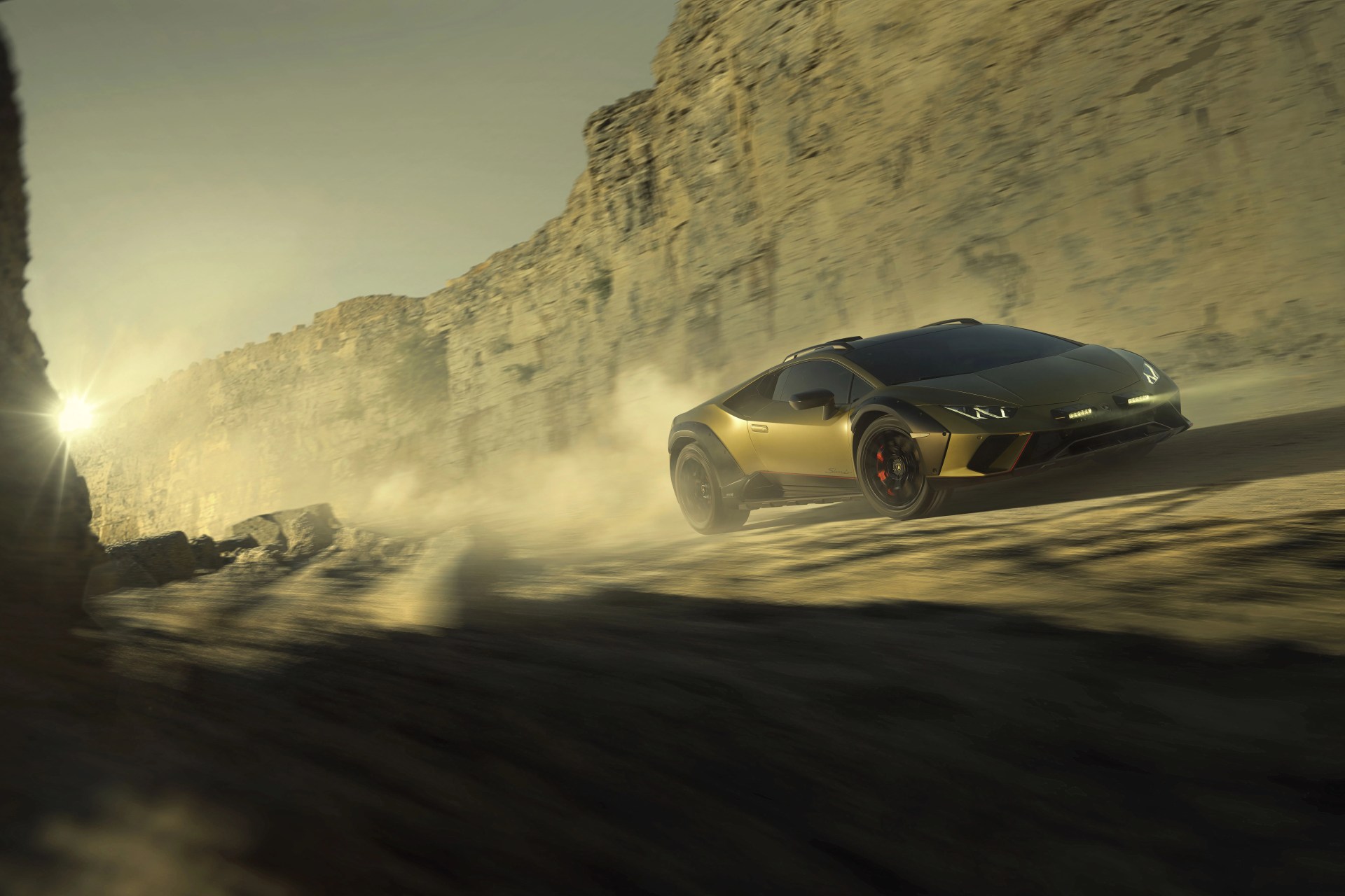 2023 lamborghini huracan sterrato driving through a desert